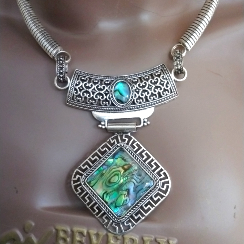 Silver & jade green,blue water colored stone with silver trimming, lightly wor